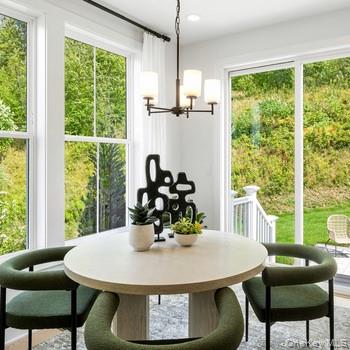 5106 Teaberry Lane, Unit 33 Fishkill, NY 12524 - Photo 4 of 5 a view of a dining room with furniture window and outside view