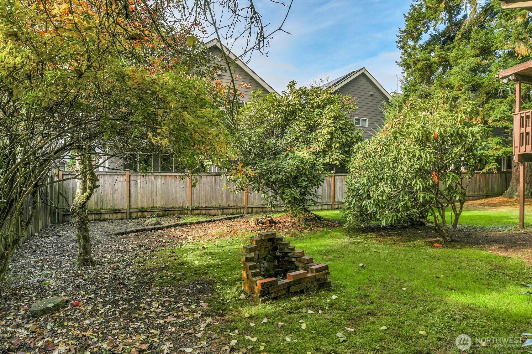 19414 1st Avenue Southeast Bothell, WA 98012 - Photo 11 of 27 a backyard of a house with plants and large trees
