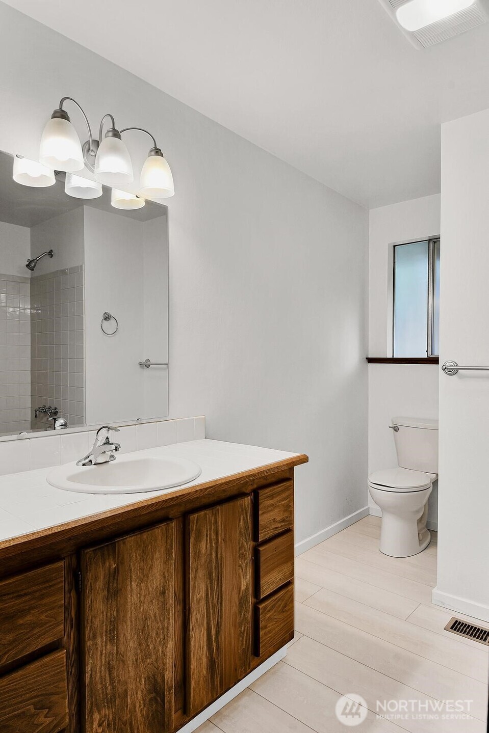 19414 1st Avenue Southeast Bothell, WA 98012 - Photo 13 of 27 a spacious bathroom with a sink and a mirror