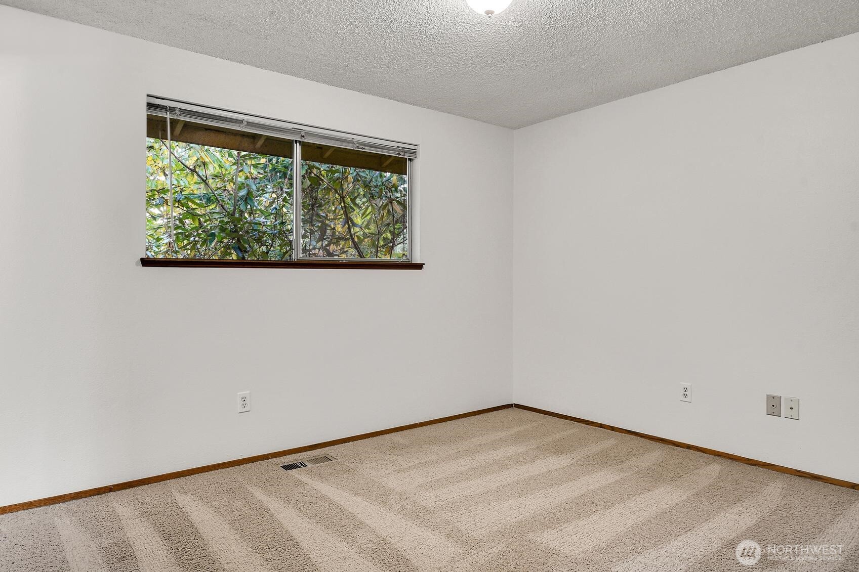 19414 1st Avenue Southeast Bothell, WA 98012 - Photo 14 of 27 an empty room with a window
