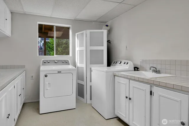 a utility room with dryer and washer