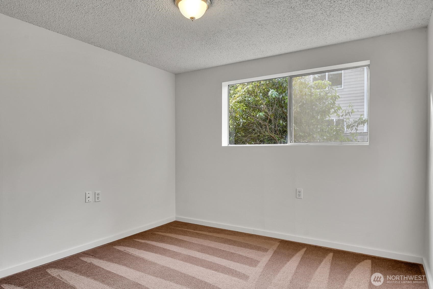 19414 1st Avenue Southeast Bothell, WA 98012 - Photo 22 of 27 a view of an empty room with a window