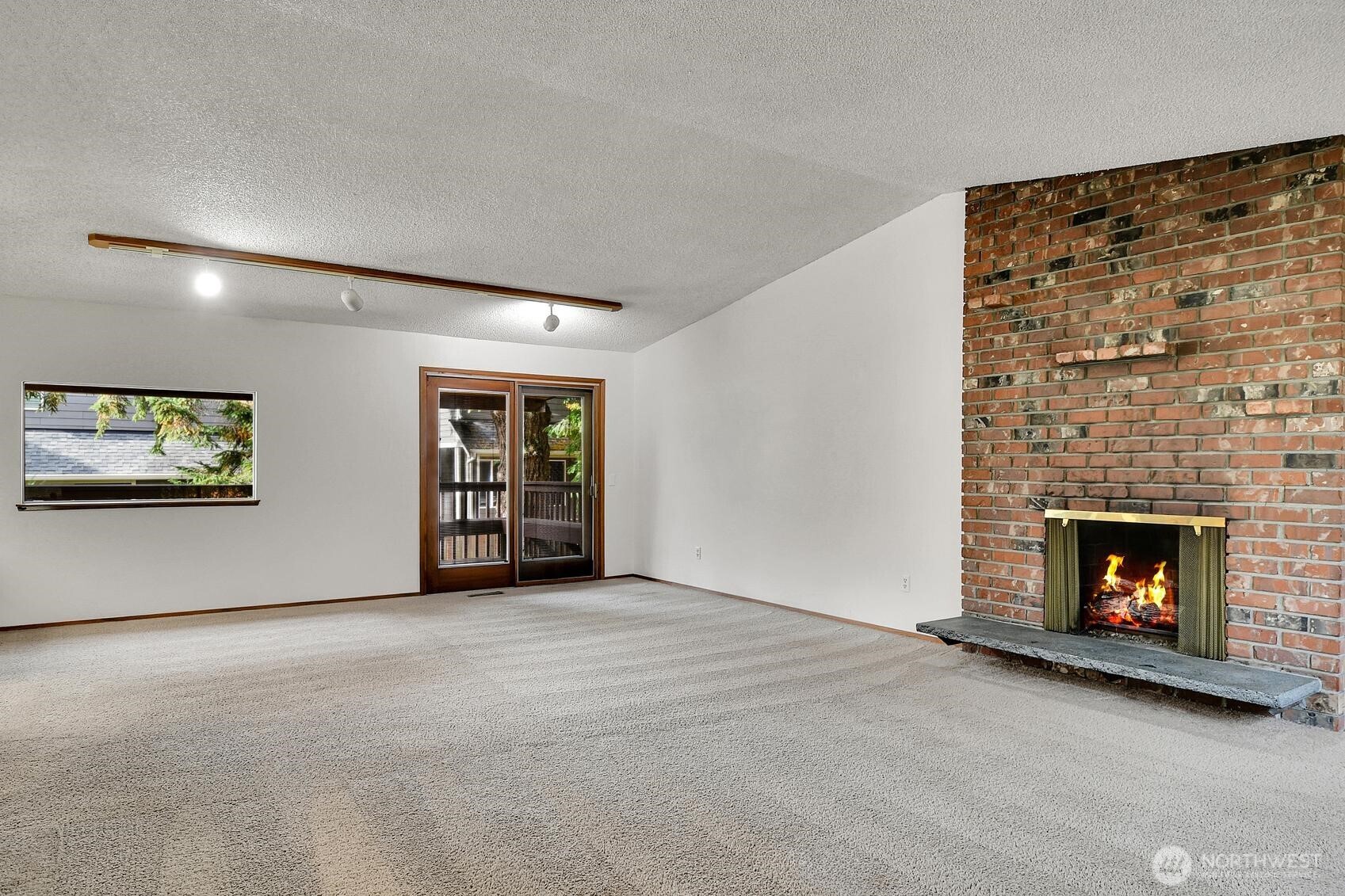 19414 1st Avenue Southeast Bothell, WA 98012 - Photo 27 of 27 a view of an empty room with fire place and a fireplace