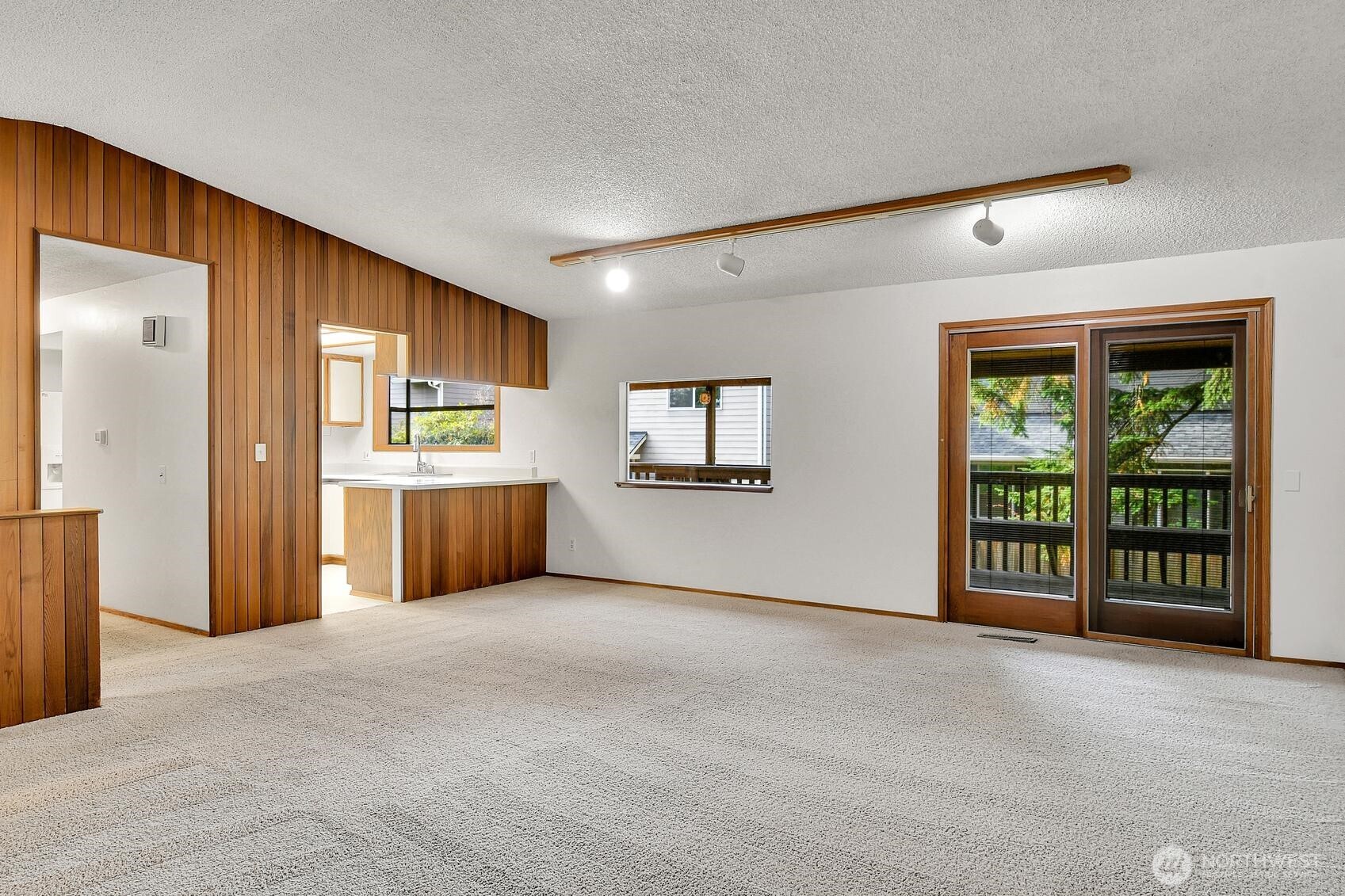 19414 1st Avenue Southeast Bothell, WA 98012 - Photo 5 of 27 a view of a kitchen with a refrigerator and a sink