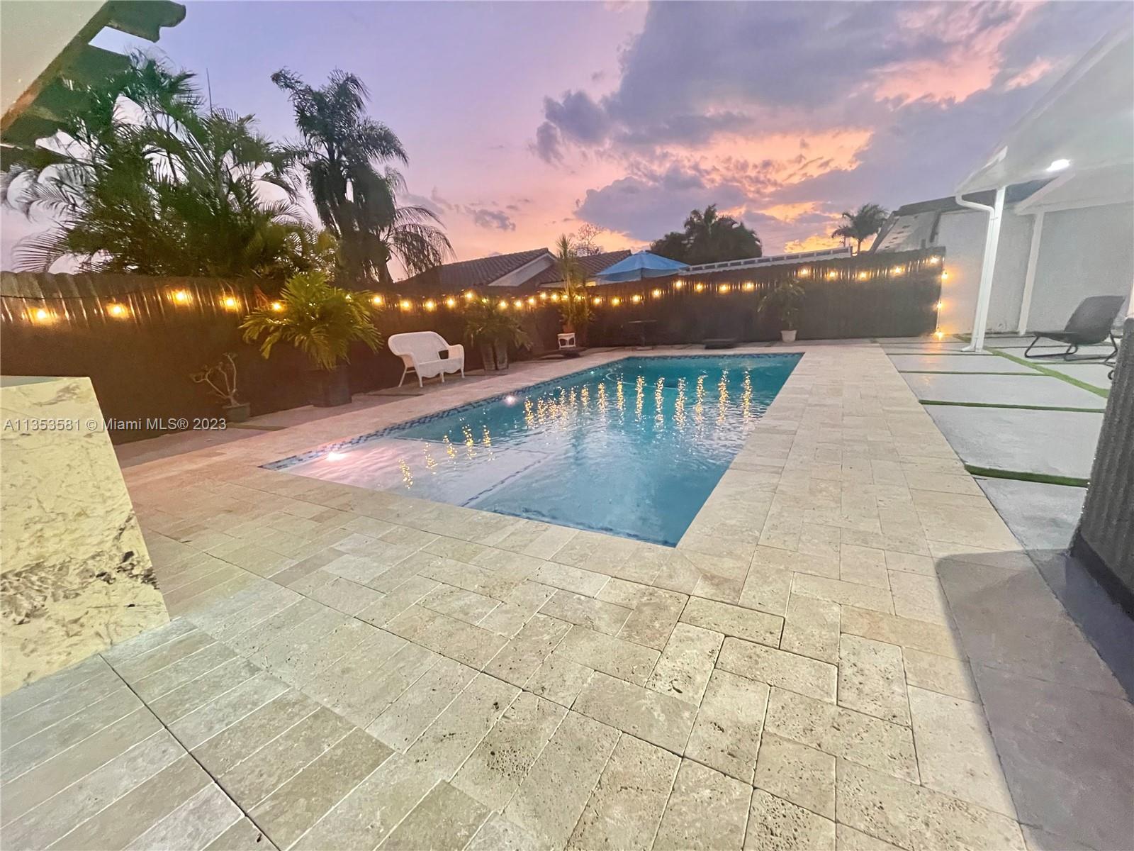 a view of a swimming pool with a lake