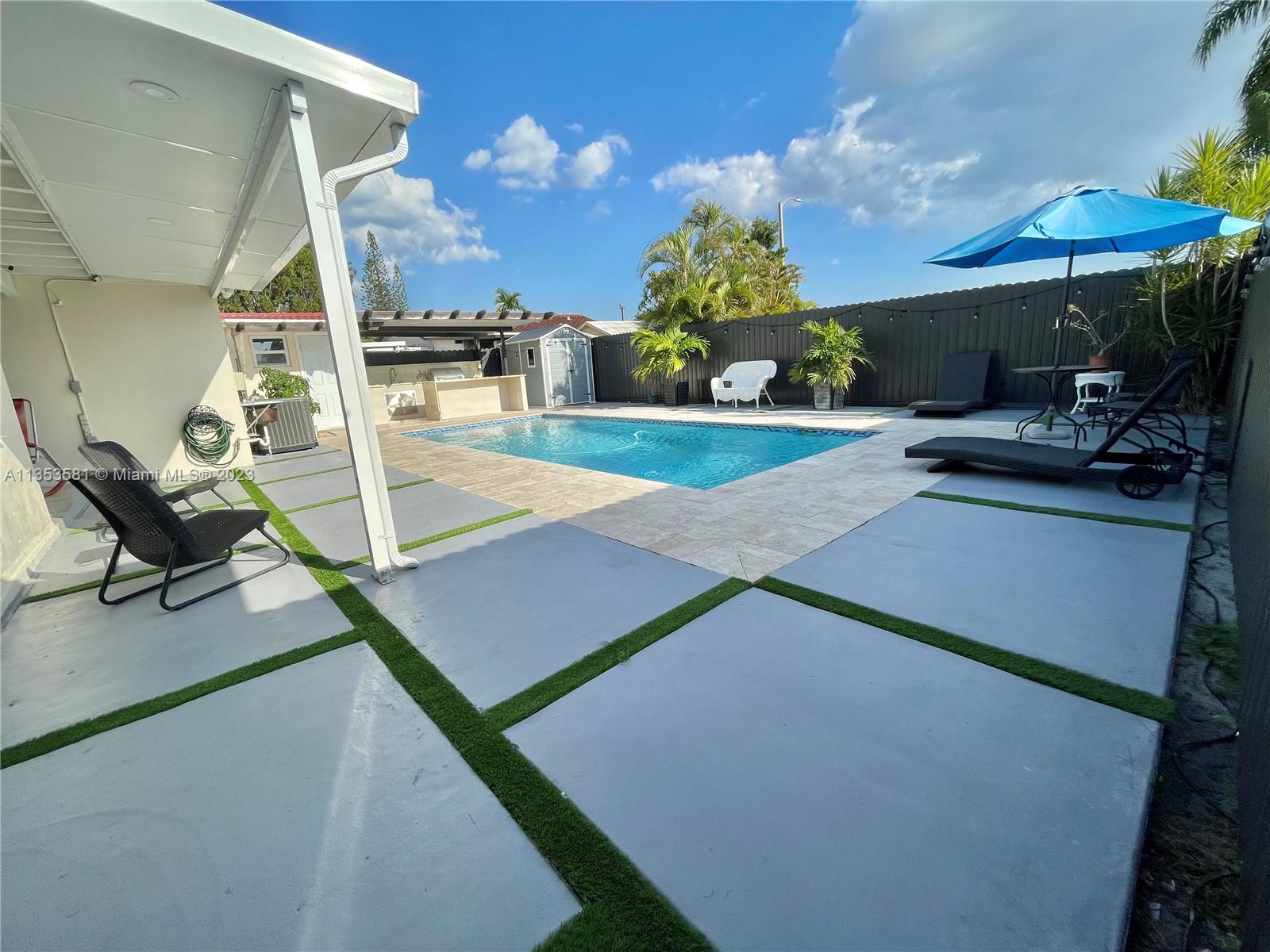 13850 Southwest 22nd Street Miami, FL 33175 - Photo 14 of 23 a view of a patio with a dining table and chairs