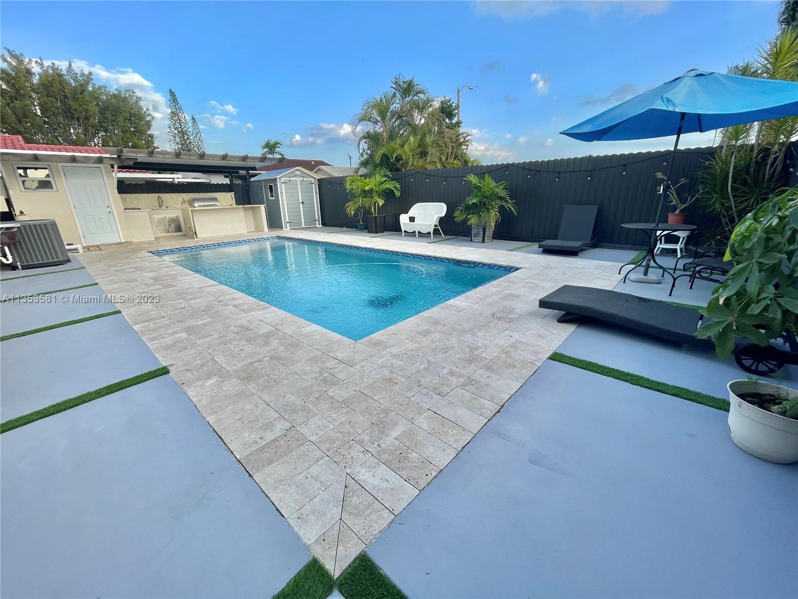 13850 Southwest 22nd Street Miami, FL 33175 - Photo 21 of 23 swimming pool view with a seating space