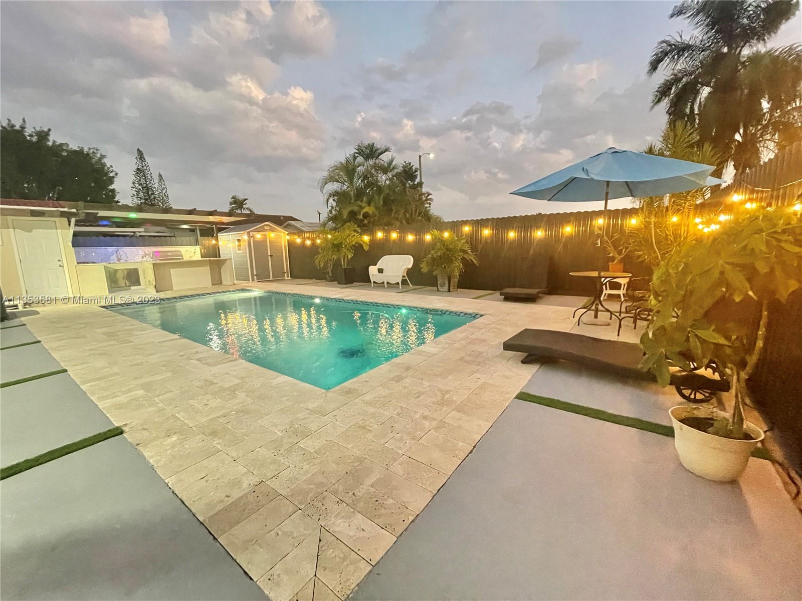 13850 Southwest 22nd Street Miami, FL 33175 - Photo 23 of 23 swimming pool view with a seating space