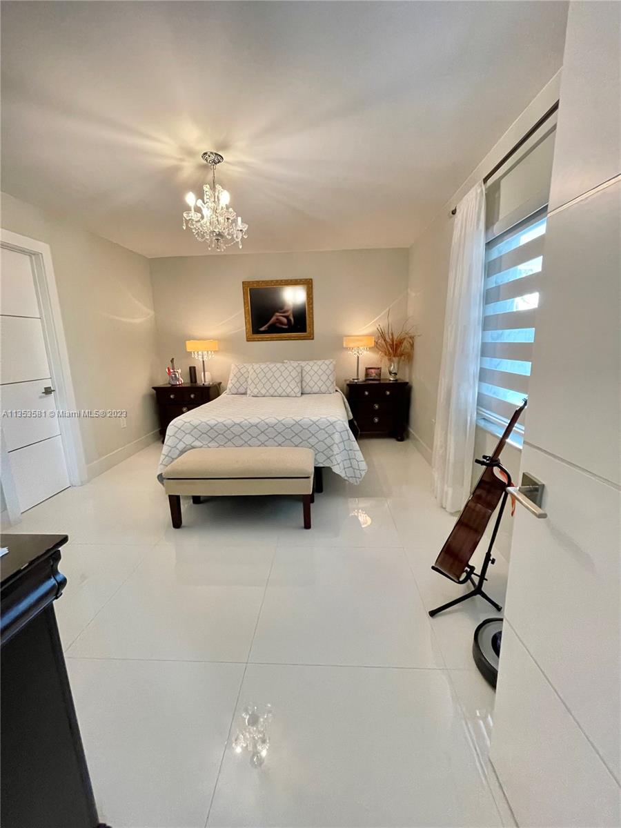 13850 Southwest 22nd Street Miami, FL 33175 - Photo 7 of 23 a bedroom with a bed furniture and a window