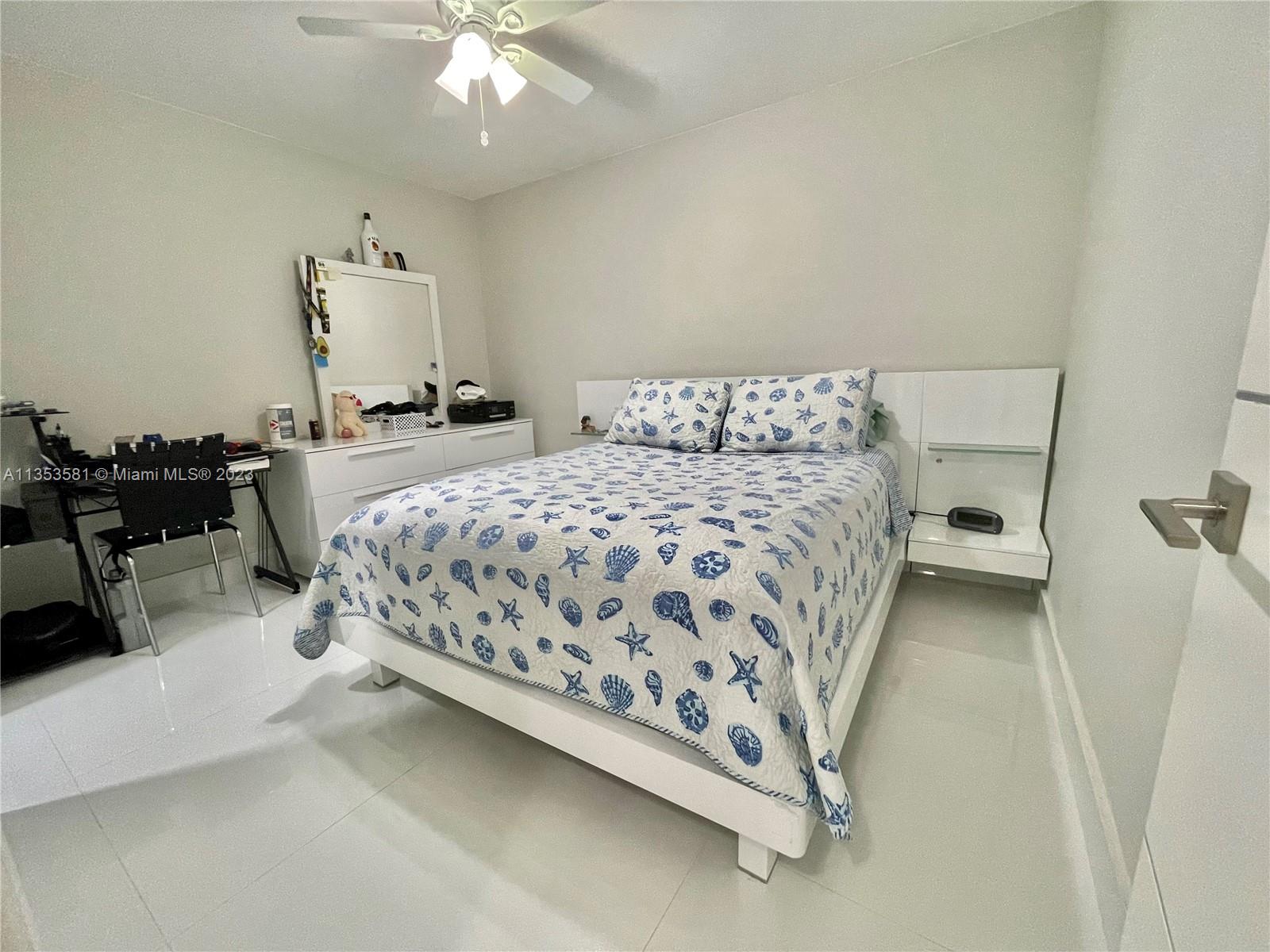 13850 Southwest 22nd Street Miami, FL 33175 - Photo 10 of 23 a bedroom with a bed and a chandelier