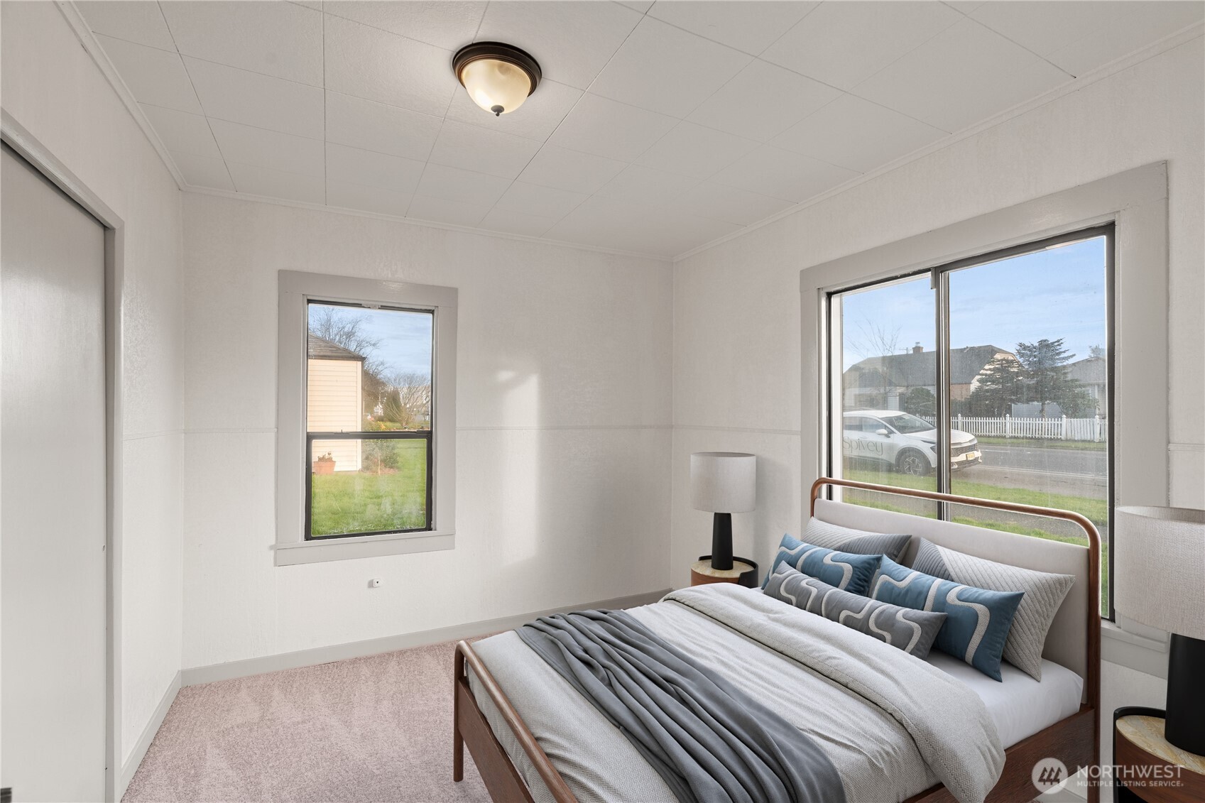 3003 Sumner Avenue Hoquiam, WA 98550 - Photo 13 of 26 a bedroom with a bed and a window