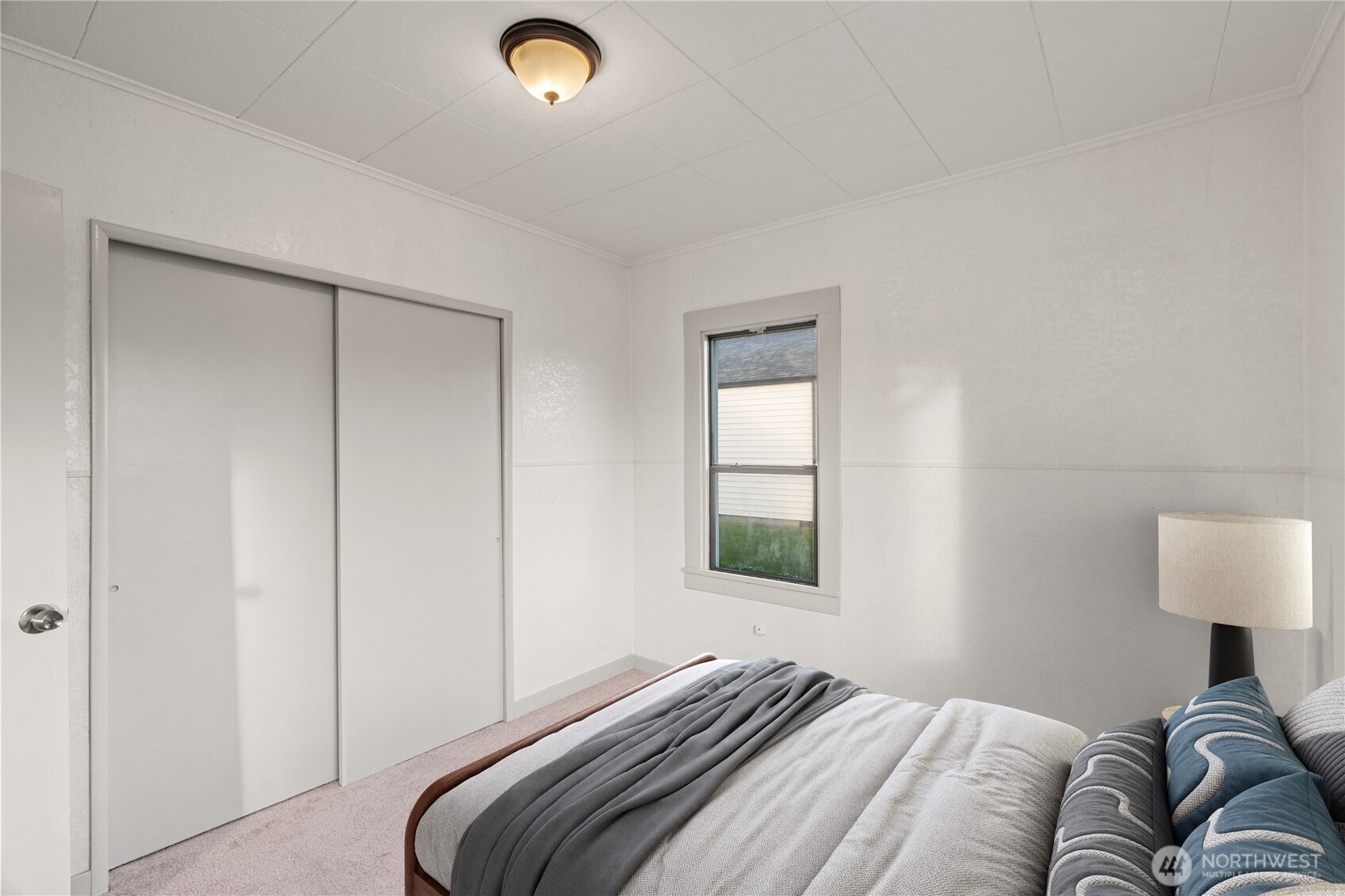 3003 Sumner Avenue Hoquiam, WA 98550 - Photo 14 of 26 a bedroom with a bed and a window