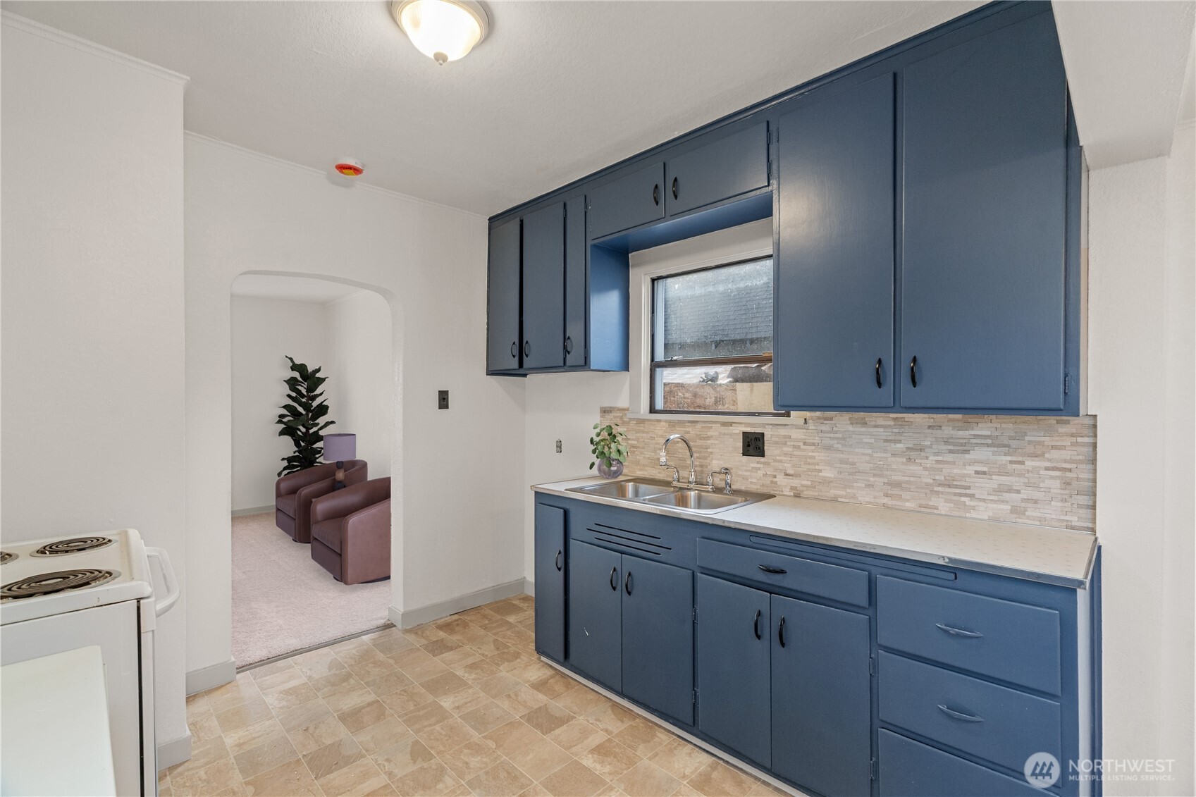 3003 Sumner Avenue Hoquiam, WA 98550 - Photo 7 of 26 a bathroom with a granite countertop sink and a mirror