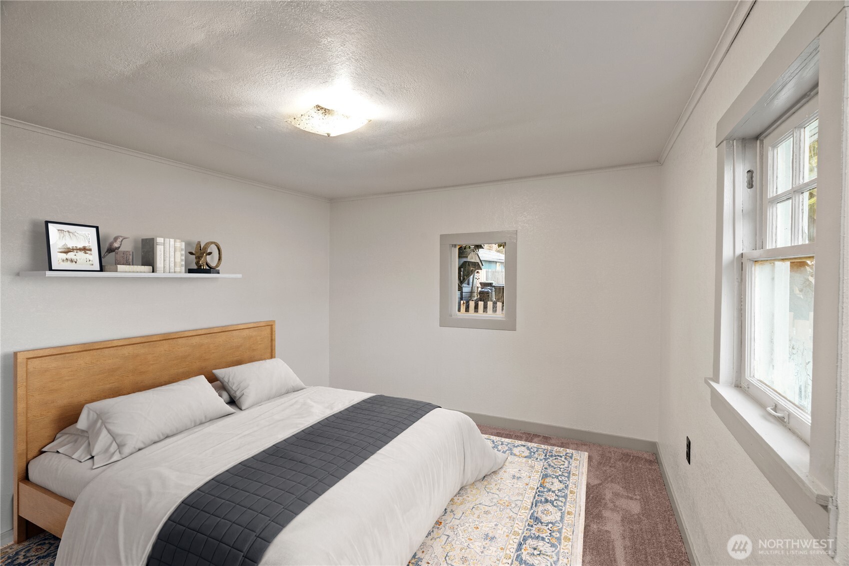 3003 Sumner Avenue Hoquiam, WA 98550 - Photo 9 of 26 a bedroom with a bed and a window