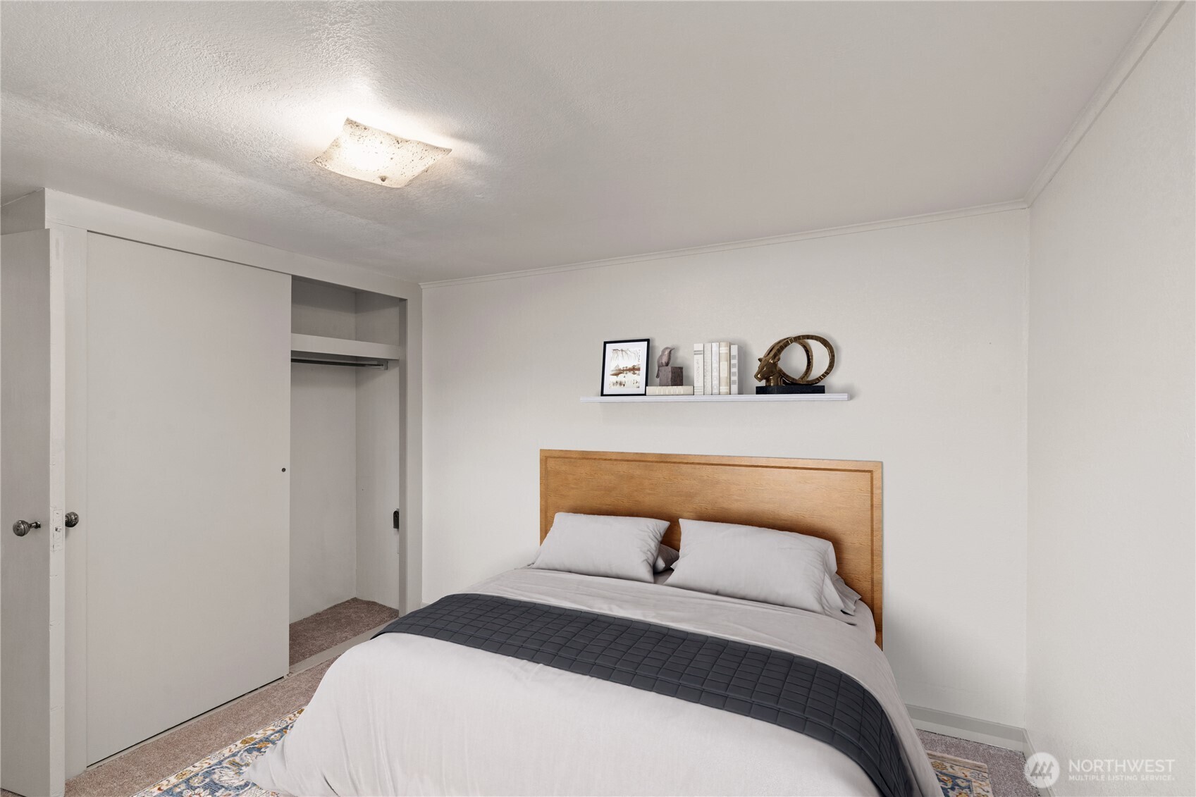 3003 Sumner Avenue Hoquiam, WA 98550 - Photo 10 of 26 a bedroom with a bed and a lamp