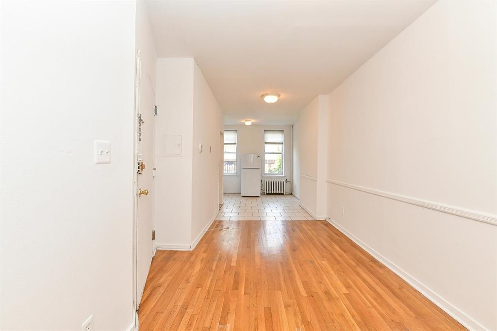 118 Adams Street, Unit 6 Hoboken, NJ 07030 - Photo 4 of 17 a view of a room with wooden floor
