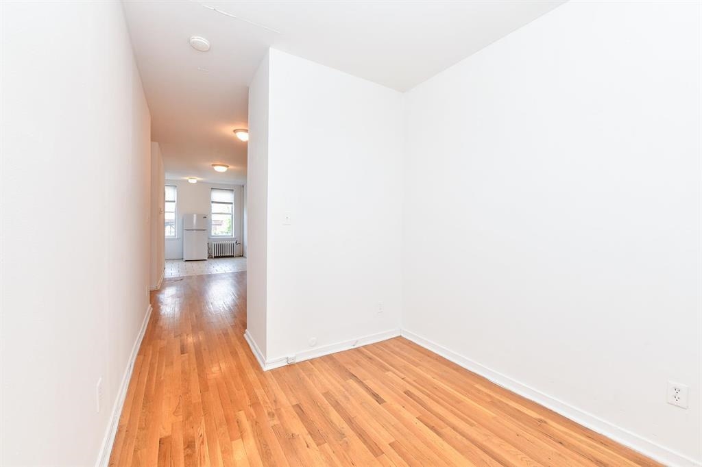 118 Adams Street, Unit 6 Hoboken, NJ 07030 - Photo 5 of 17 a view of a hallway with wooden floor
