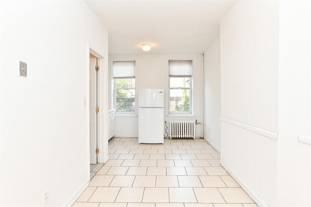 118 Adams Street, Unit 6 Hoboken, NJ 07030 - Photo 7 of 17 a view of an empty room with a window