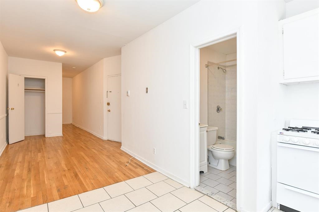 118 Adams Street, Unit 6 Hoboken, NJ 07030 - Photo 8 of 17 a bathroom with a toilet sink and a shower