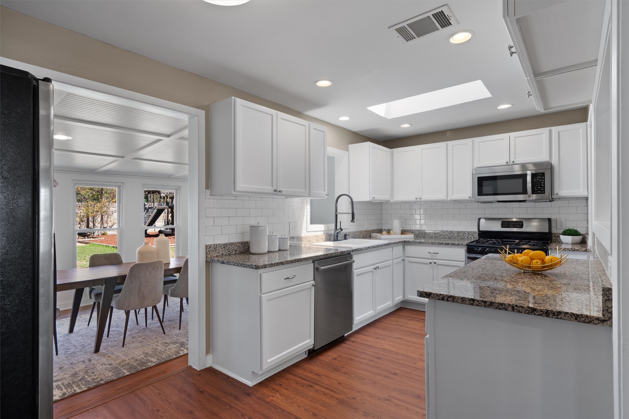 1904 Morrow Street Austin, TX 78757 - Photo 14 of 28 The kitchen stays connected to the dining area while still feeling like its own defined space.