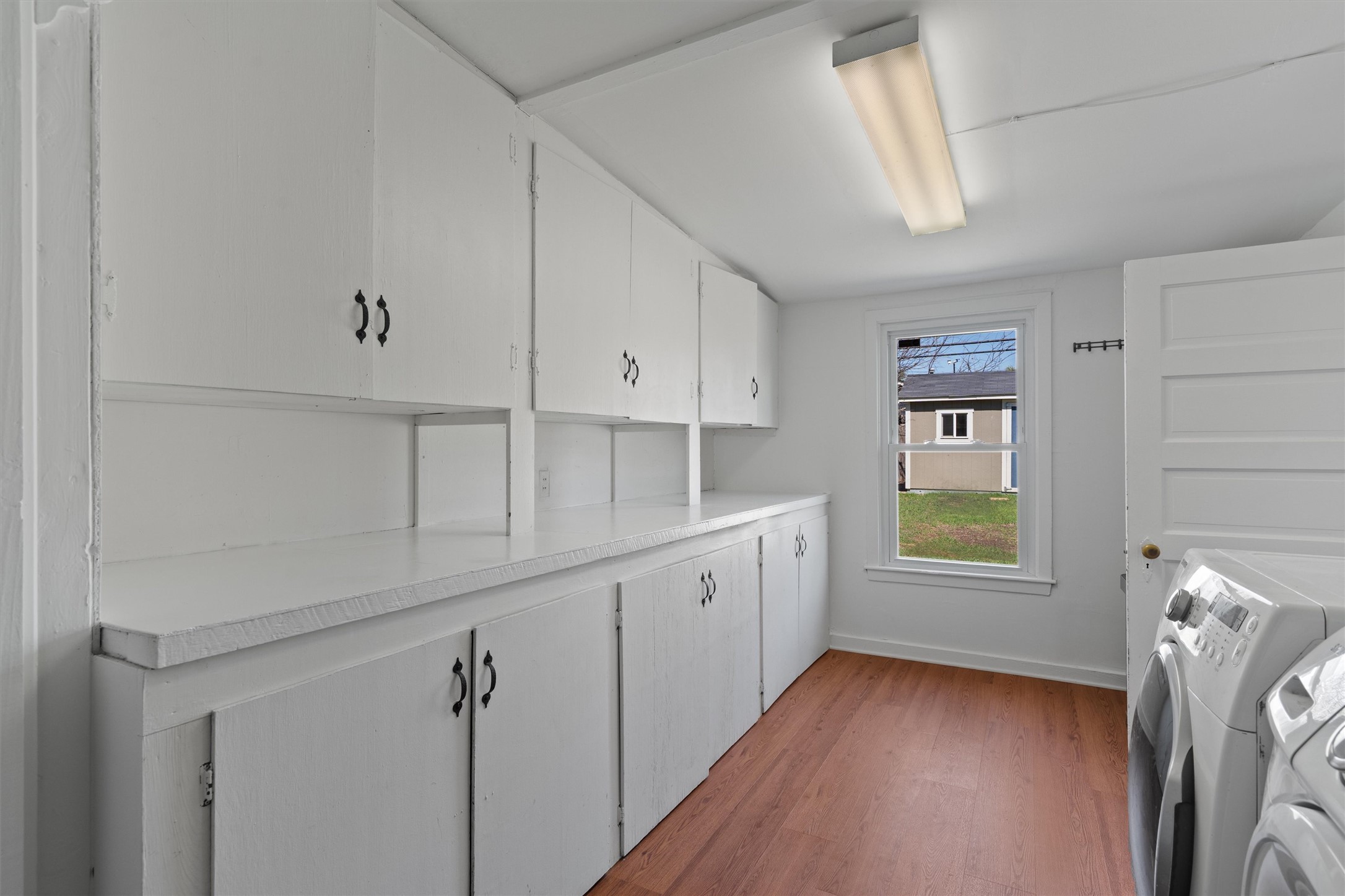 1904 Morrow Street Austin, TX 78757 - Photo 17 of 28 The laundry room pulls double duty with plenty of extra storage, making it a practical pantry space too.