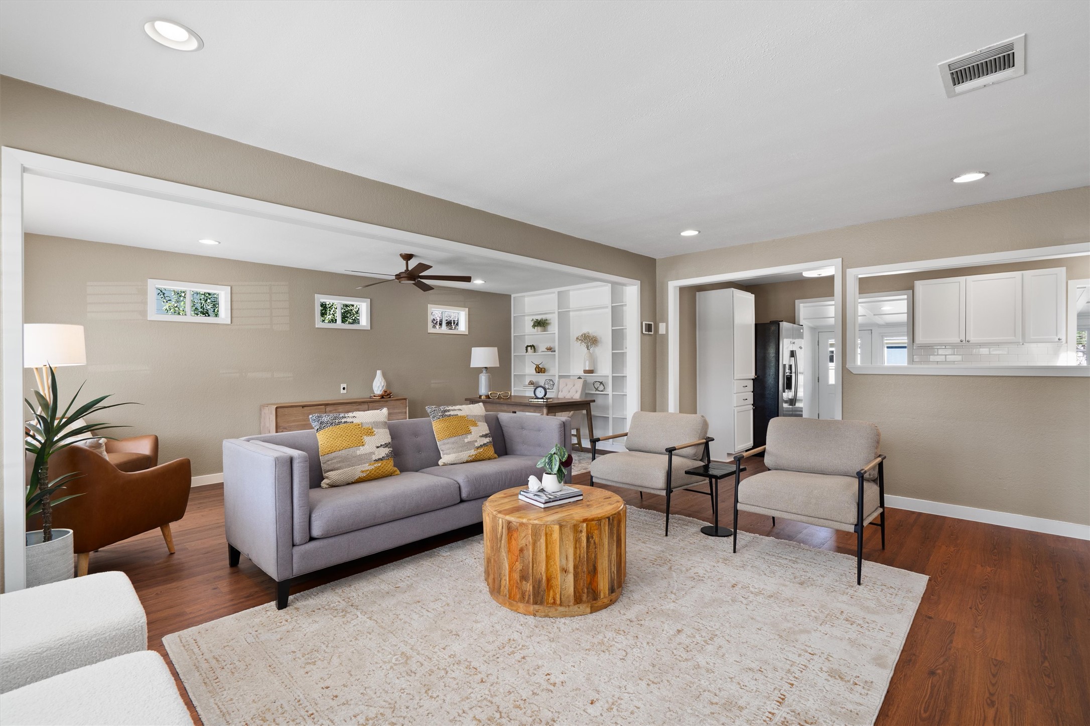 1904 Morrow Street Austin, TX 78757 - Photo 2 of 28 The spacious living room is especially flexible, with enough room to function as one large gathering space.