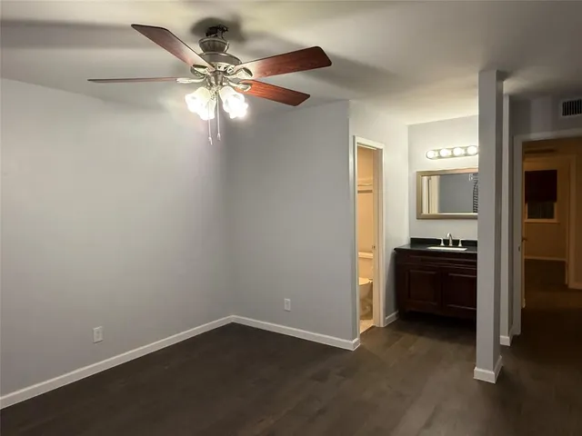 wooden floor in an empty room and a kitchen