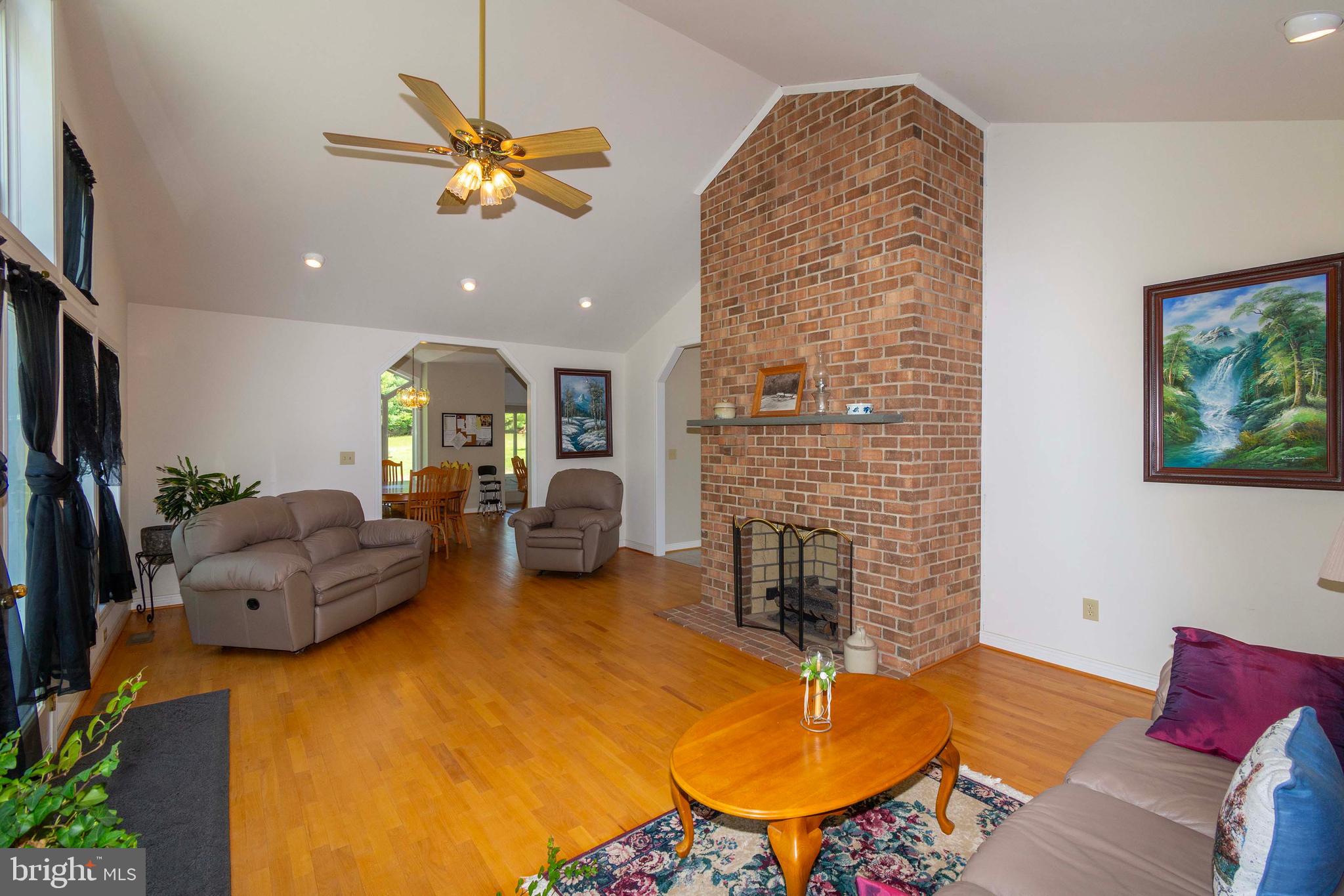 6000 Haleys Mill Road Spotsylvania, VA 22551 - Photo 22 of 85 a living room with furniture and a fireplace
