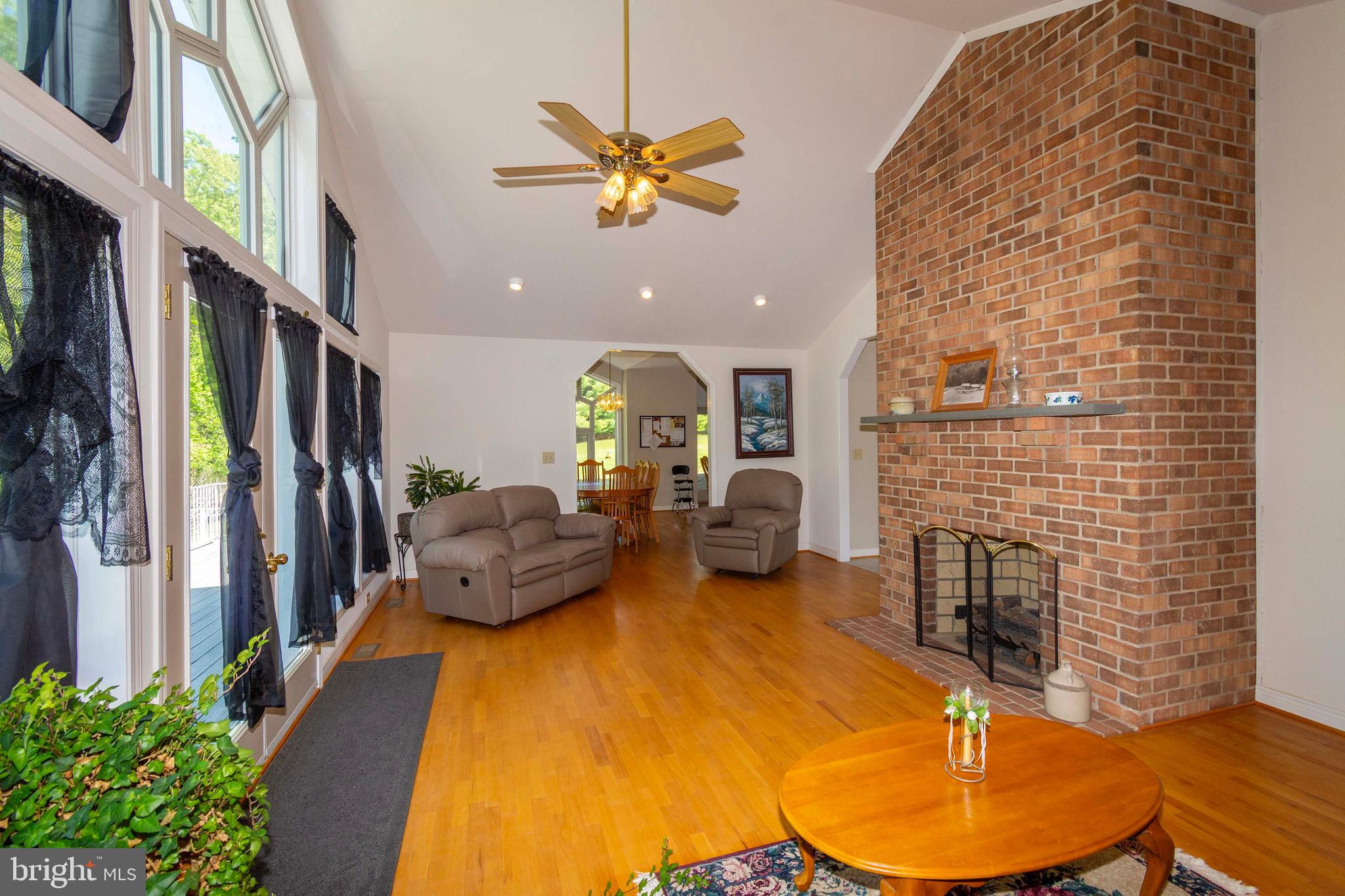 6000 Haleys Mill Road Spotsylvania, VA 22551 - Photo 23 of 85 a living room with furniture and a fireplace