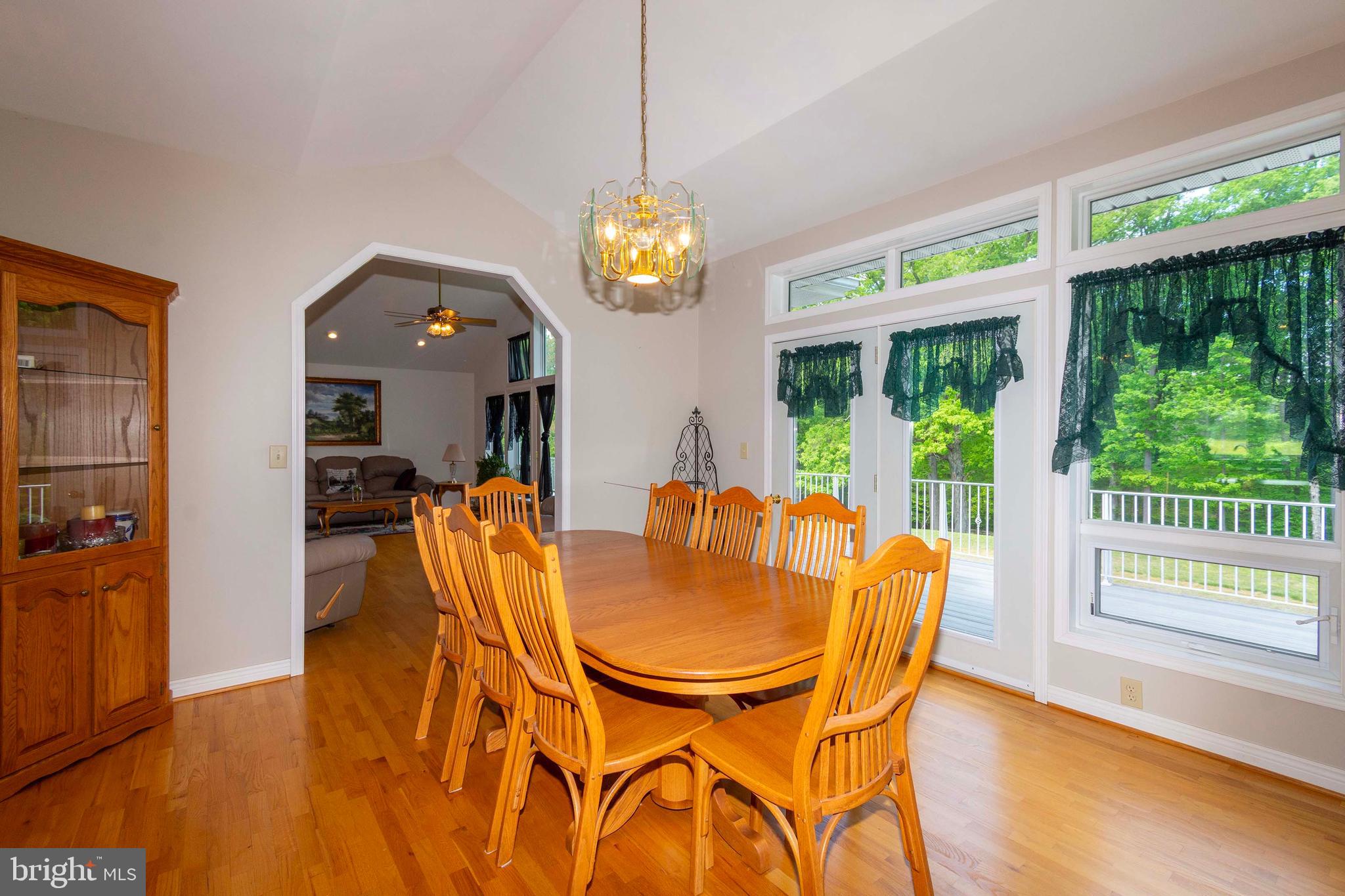 6000 Haleys Mill Road Spotsylvania, VA 22551 - Photo 26 of 85 a dining room with furniture a flat screen tv and a chandelier