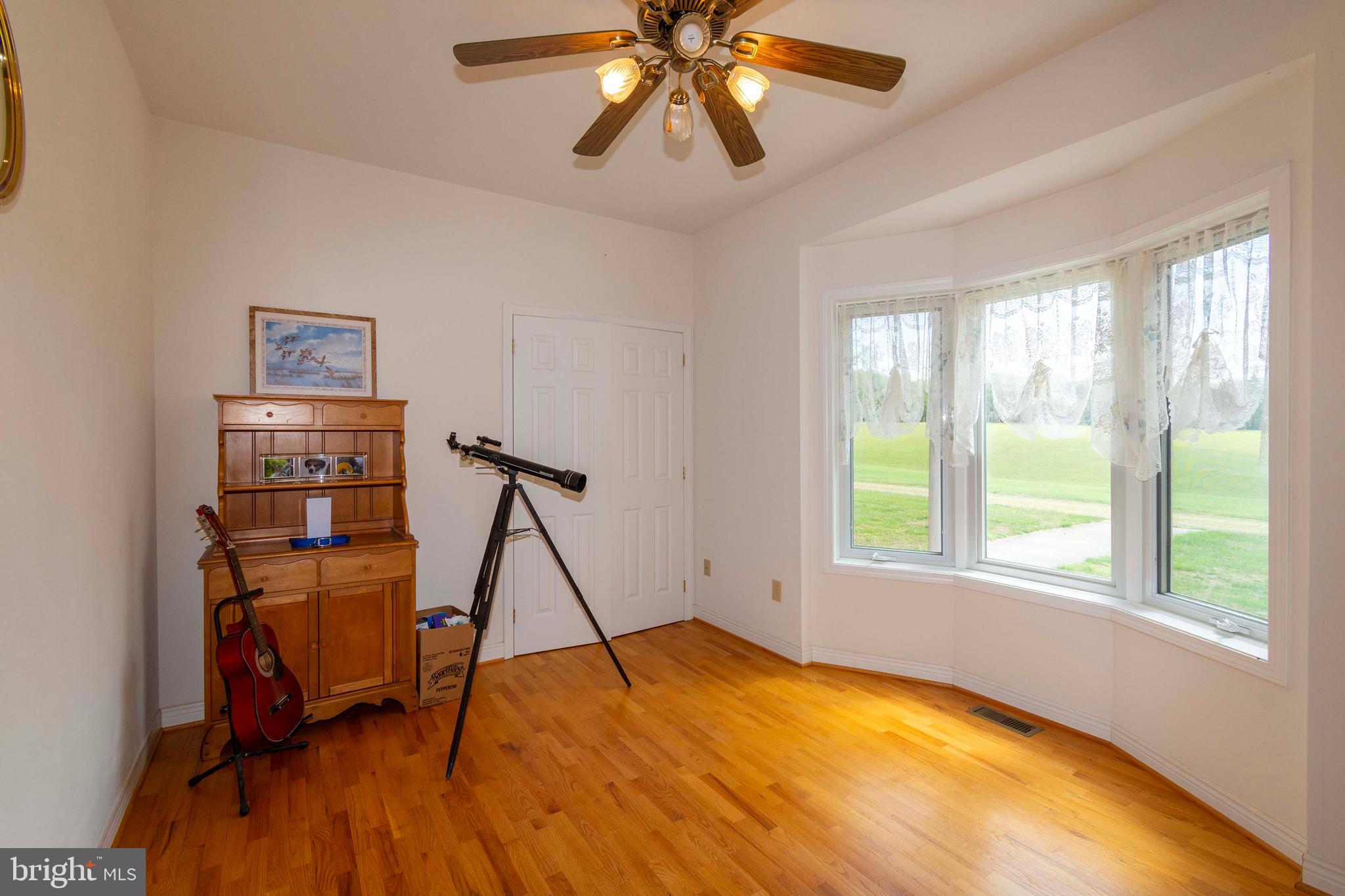 6000 Haleys Mill Road Spotsylvania, VA 22551 - Photo 32 of 85 a view of an empty room with chandelier fan and a window