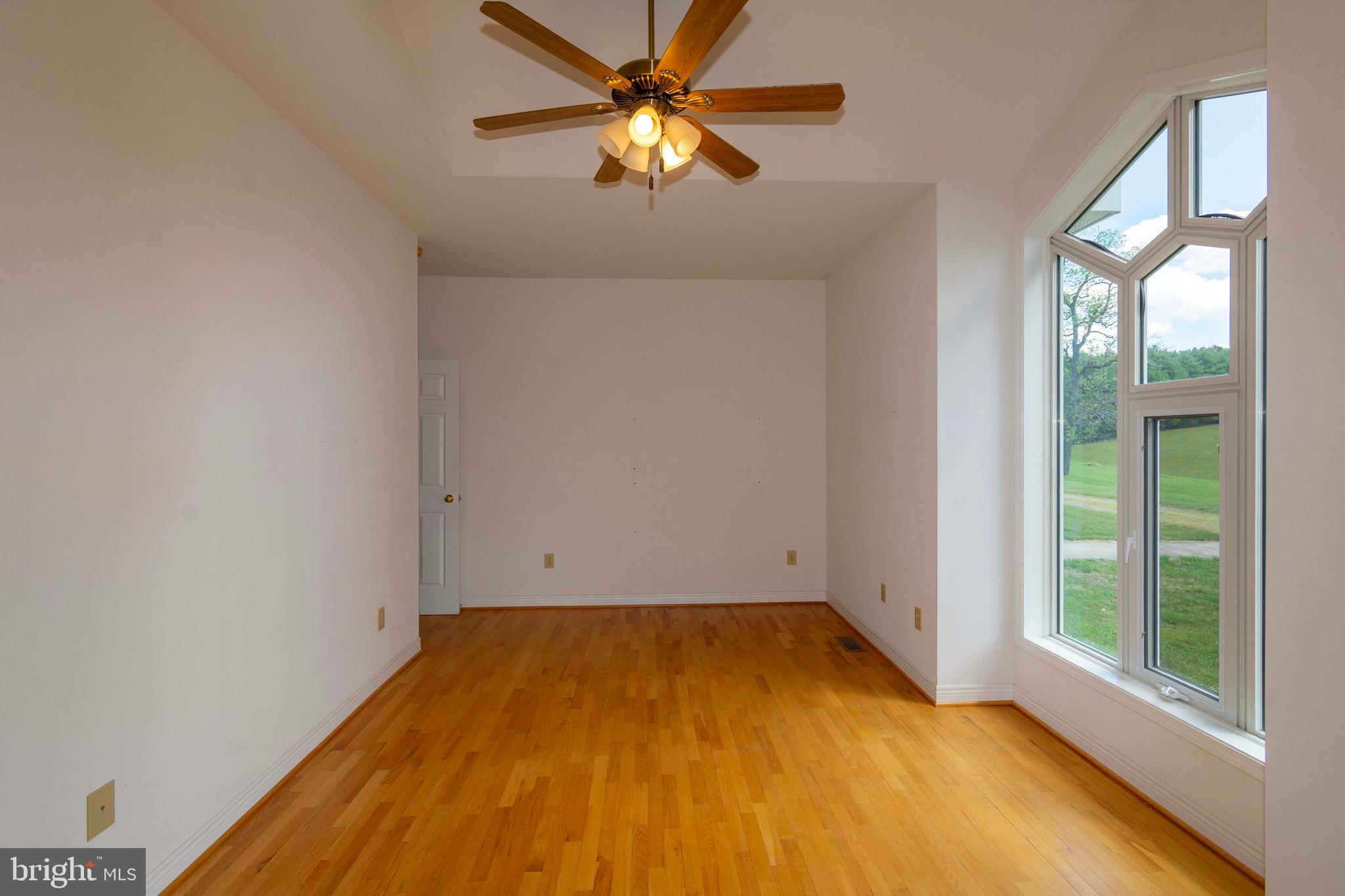 6000 Haleys Mill Road Spotsylvania, VA 22551 - Photo 38 of 85 a view of a room with a window and a ceiling fan