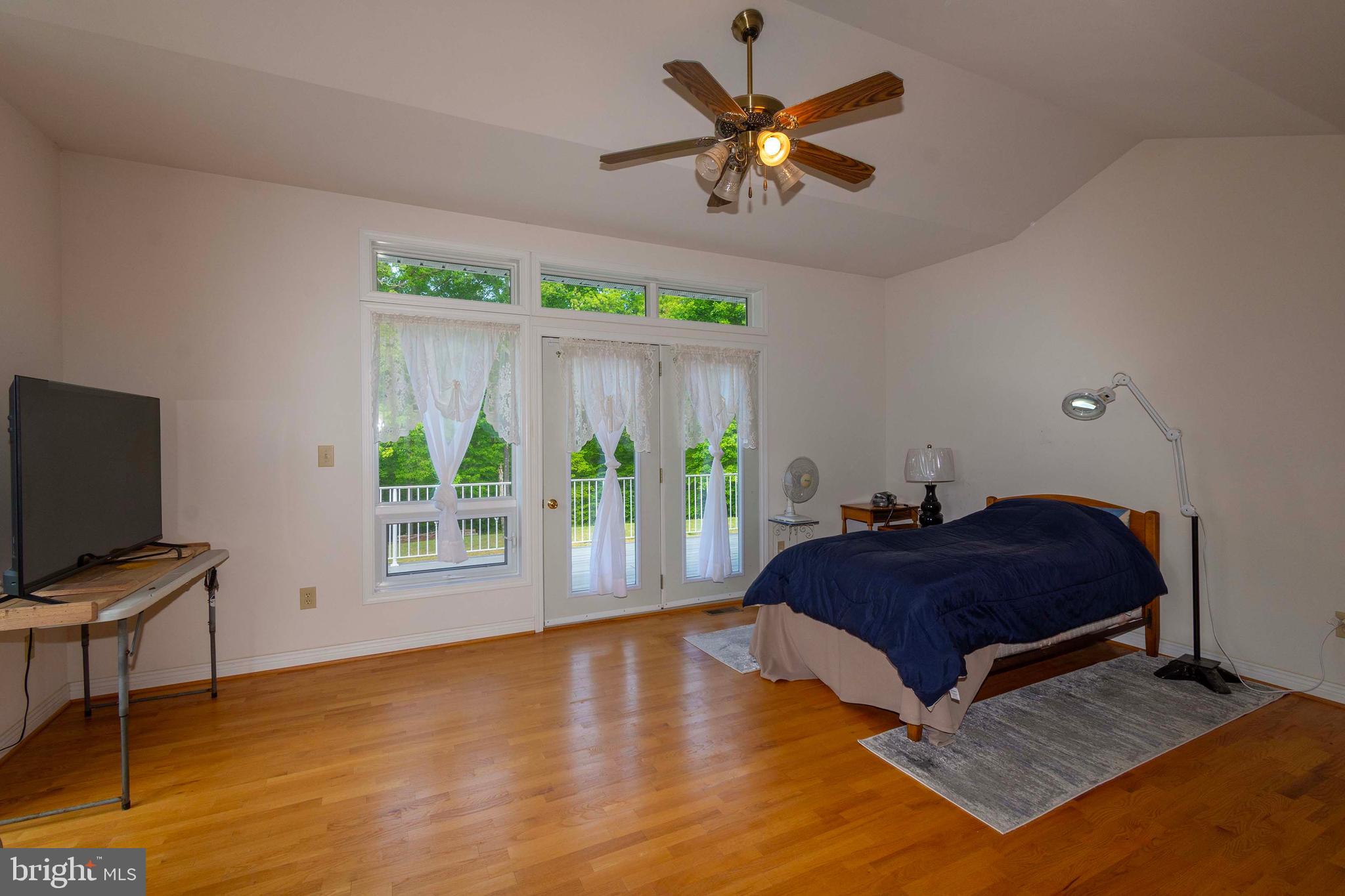 6000 Haleys Mill Road Spotsylvania, VA 22551 - Photo 41 of 85 a living room with a bed furniture and a flat screen tv
