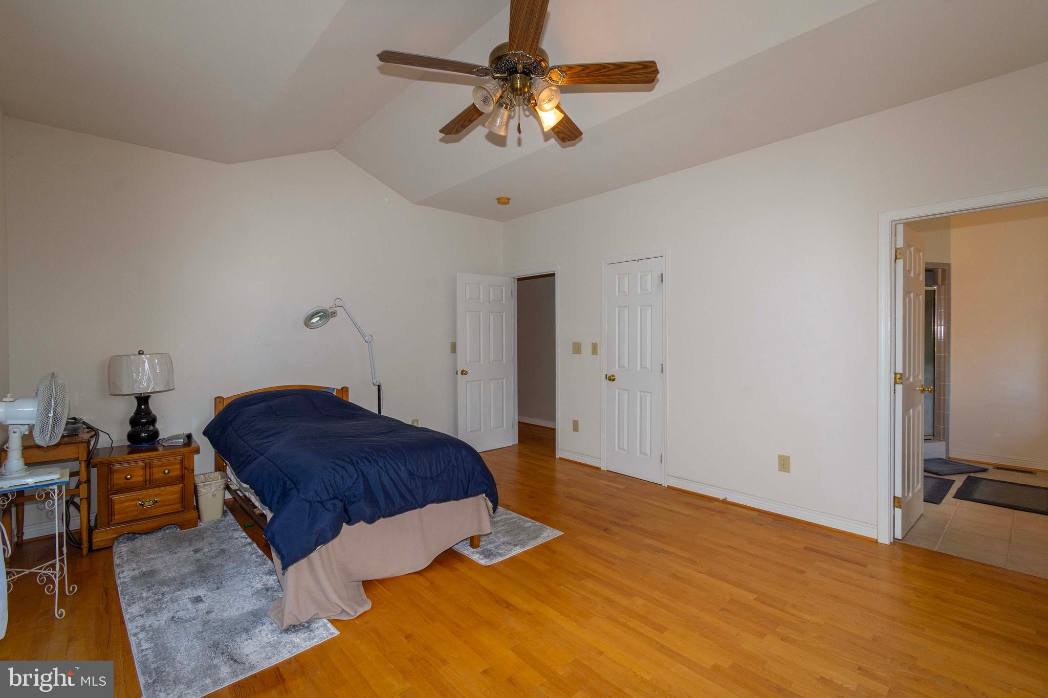 6000 Haleys Mill Road Spotsylvania, VA 22551 - Photo 43 of 85 a bedroom with a bed and a chandelier fan