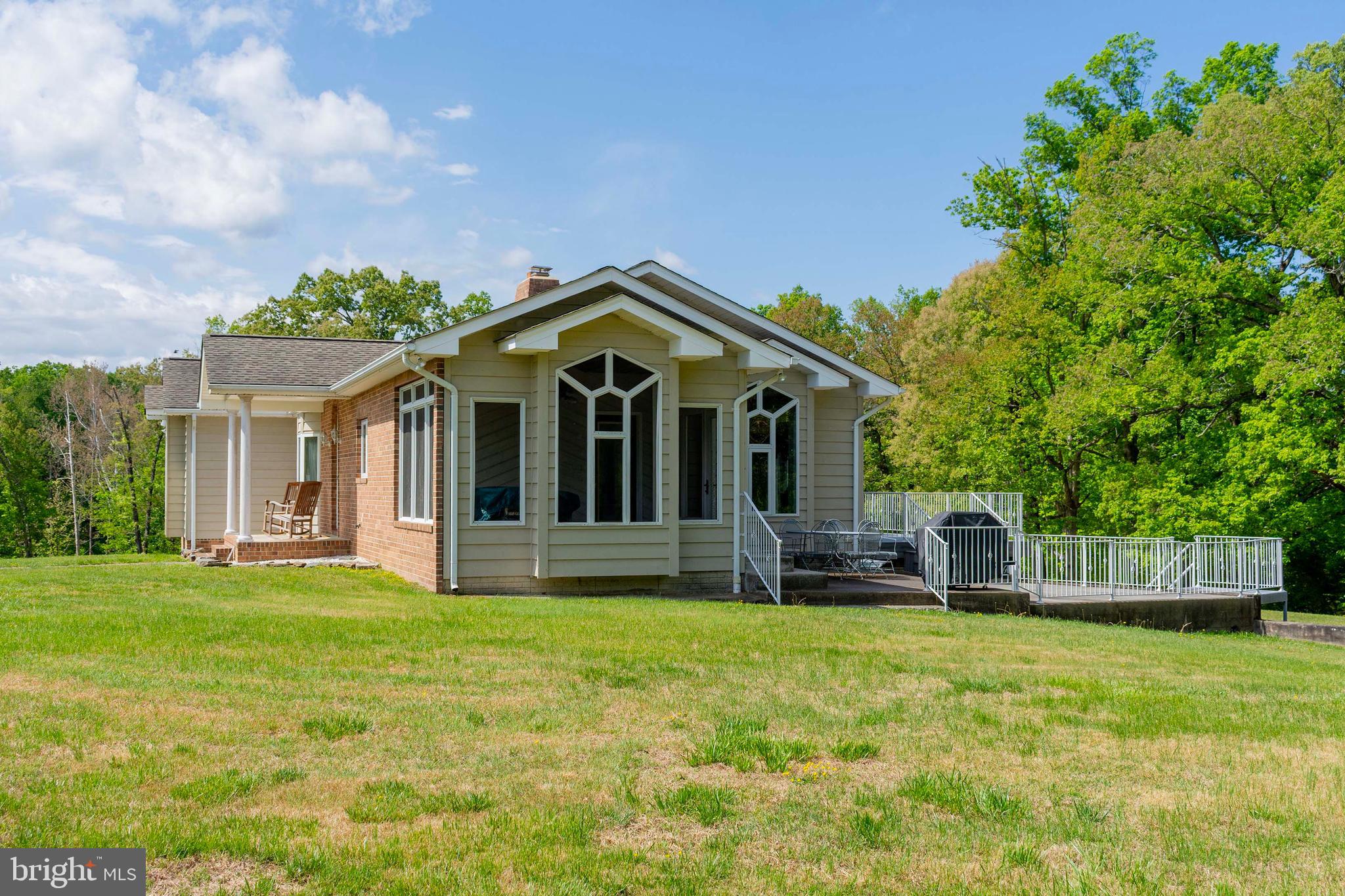 6000 Haleys Mill Road Spotsylvania, VA 22551 - Photo 7 of 85 a front view of a house with a garden and yard