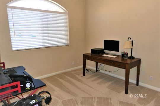421 Mavis Court Ridgecrest, CA 93555 - Photo 16 of 33 a view of a workspace with furniture and a window