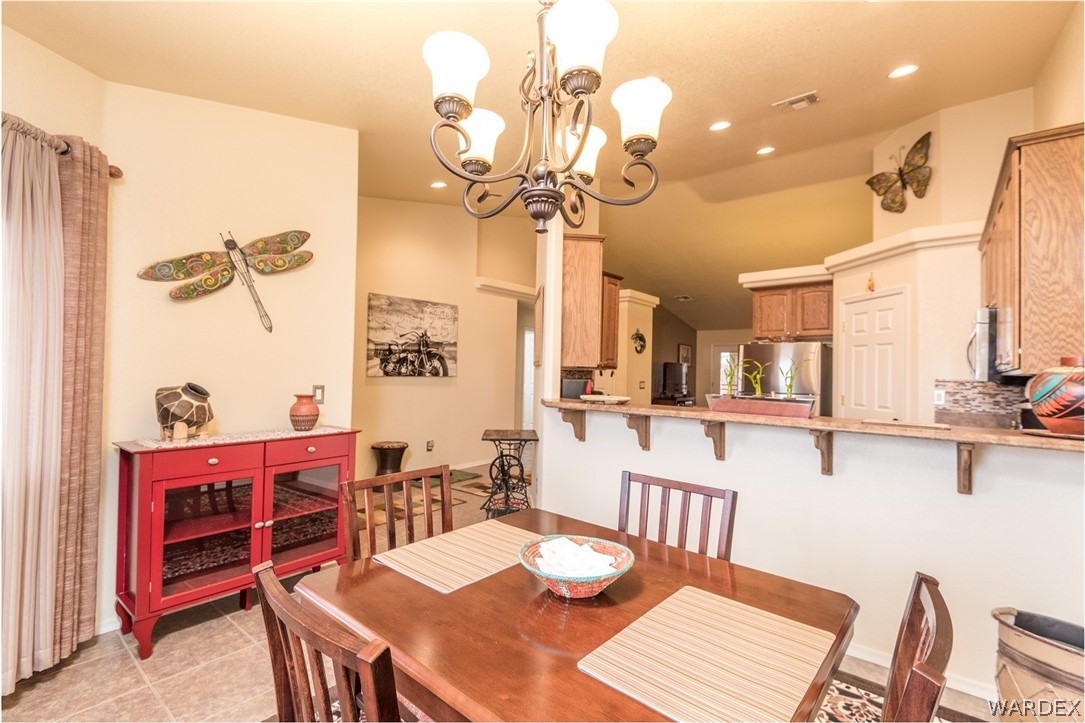 4292 East Cane Ranch Road Kingman, AZ 86401 - Photo 8 of 34 a view of a dining room with furniture
