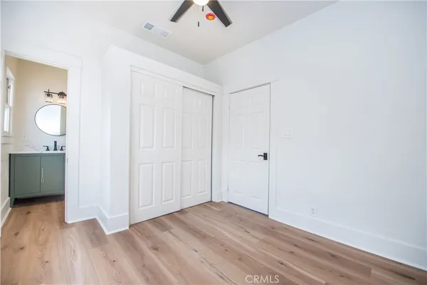 a view of an empty room and wooden floor