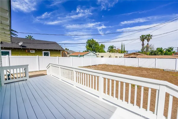 a view of a balcony with wooden floor