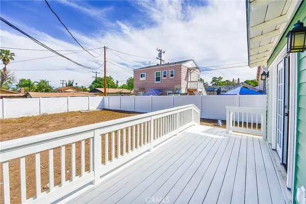 a view of balcony with wooden floor