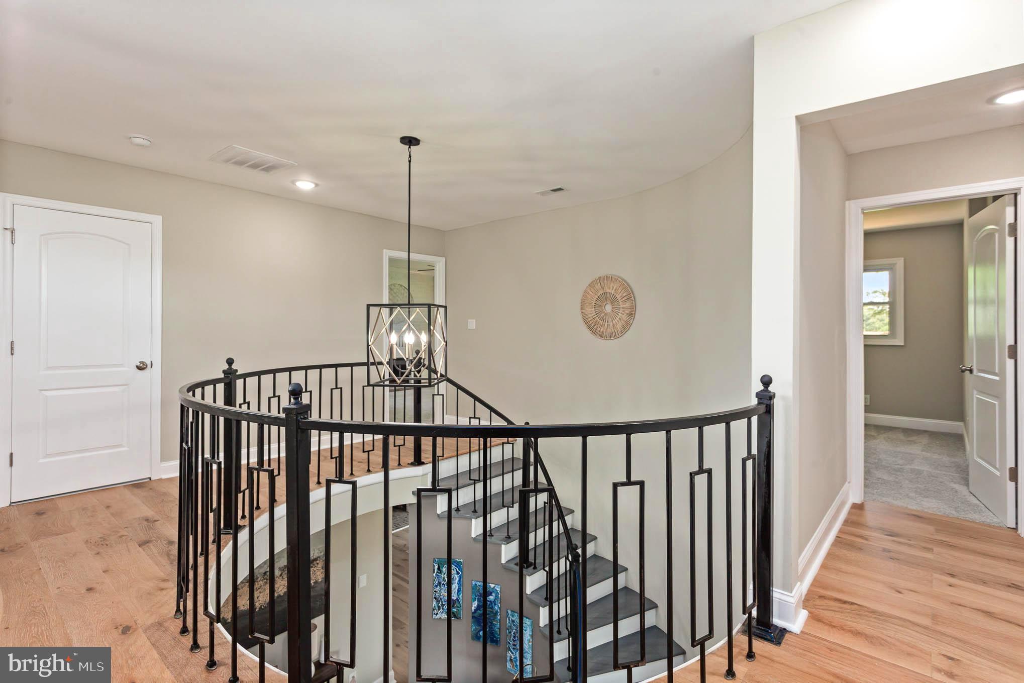 5740 Allender Road White Marsh, MD 21162 - Photo 24 of 60 Center circular 2 story stairs w custom railing