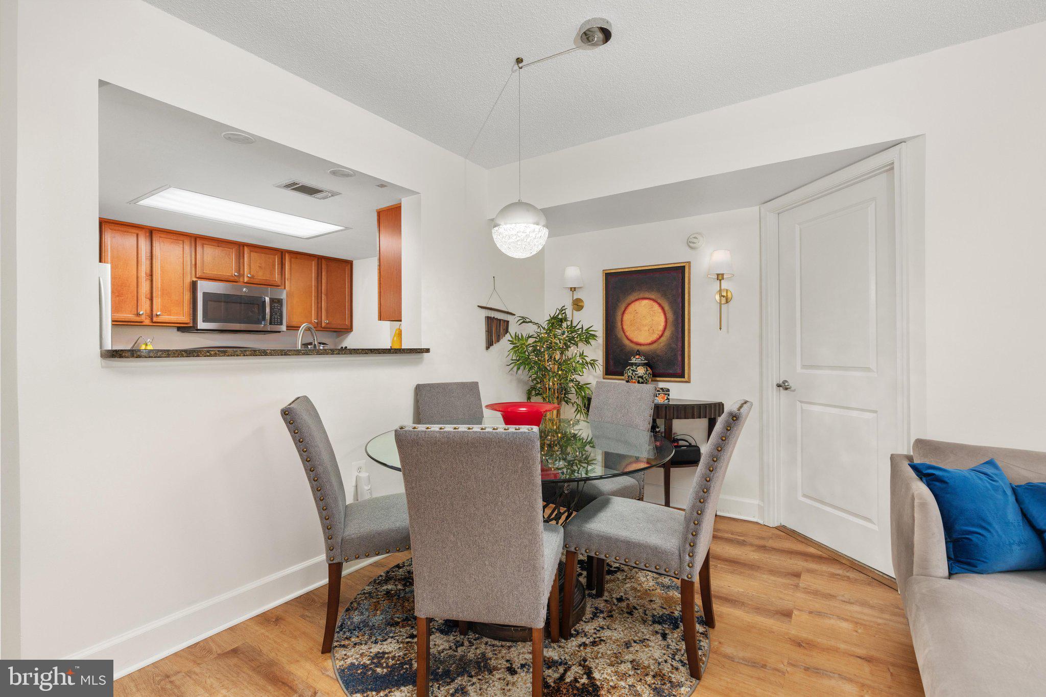 11800 Sunset Hills Road, Unit 815 Reston, VA 20190 - Photo 8 of 61 Dining Area with Decorative Light Fixture