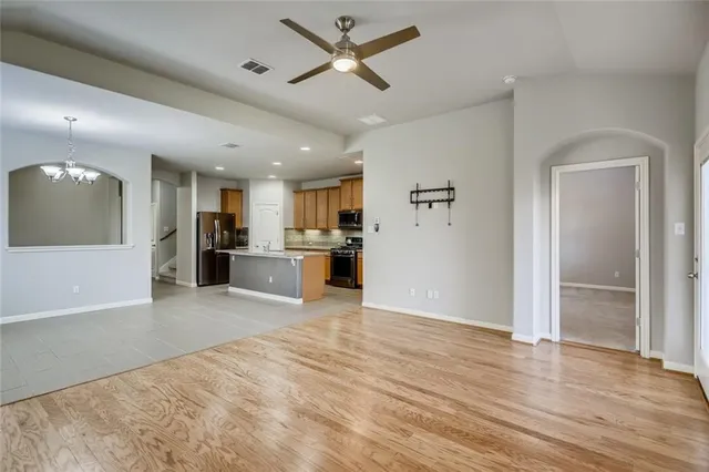 a view of a kitchen with a refrigerator and a sink