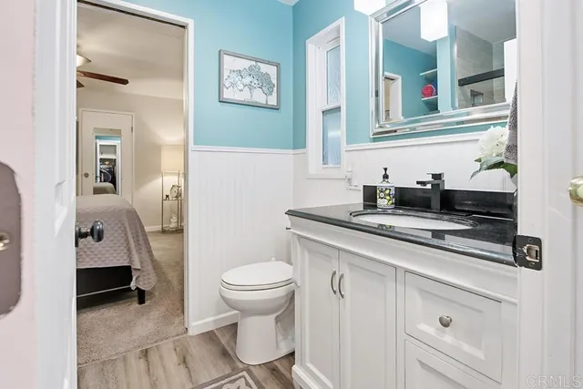 a spacious bathroom with a sink and a toilet
