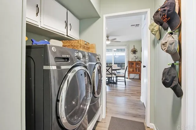 a view of a hallway with washer and dryer