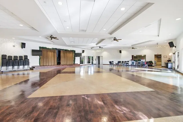 a view of a living room and kitchen