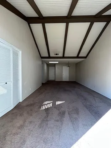 a view of empty room with windows