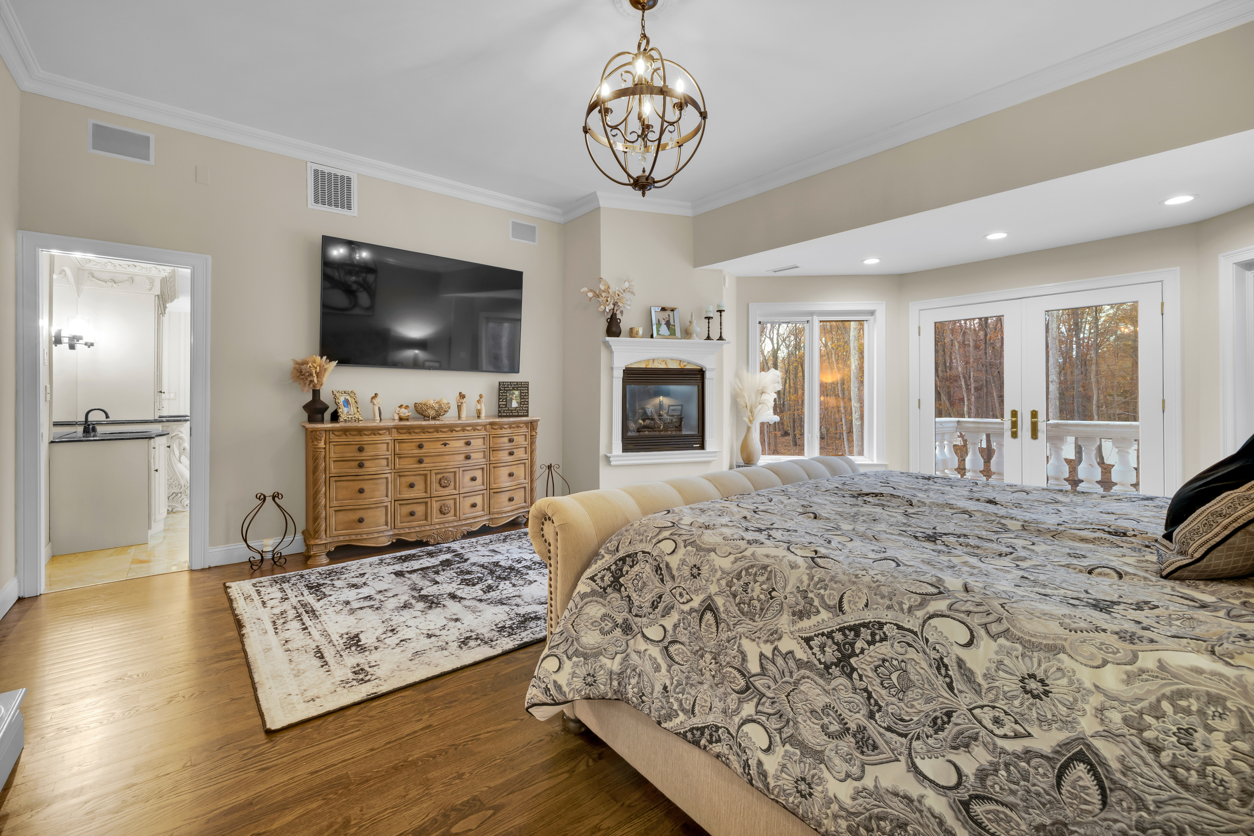 65 Ironwood Road Guilford, CT 06437 - Photo 19 of 40 a spacious bedroom with a bed and a flat screen tv