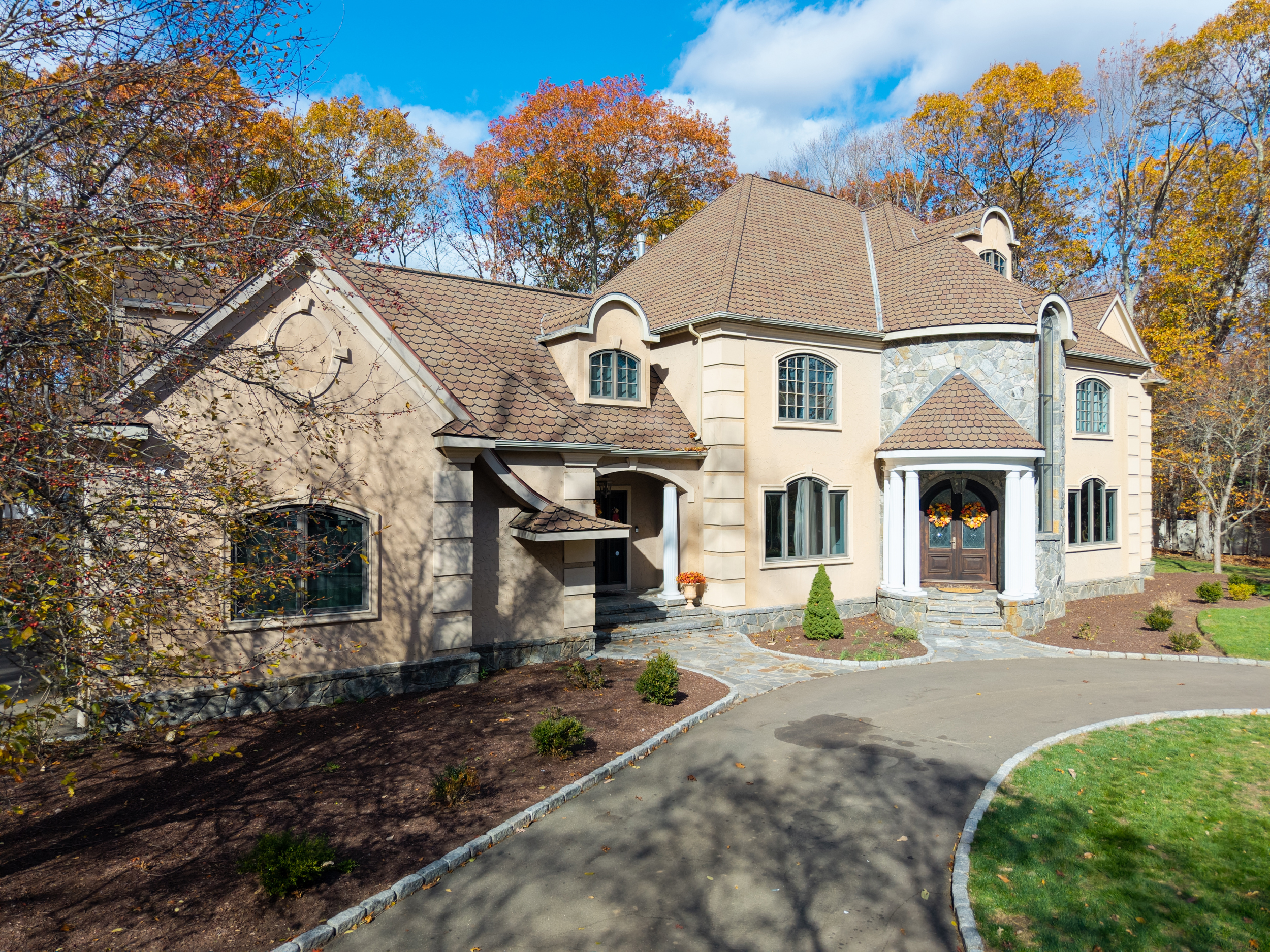 65 Ironwood Road Guilford, CT 06437 - Photo 3 of 40 a front view of a house with a yard
