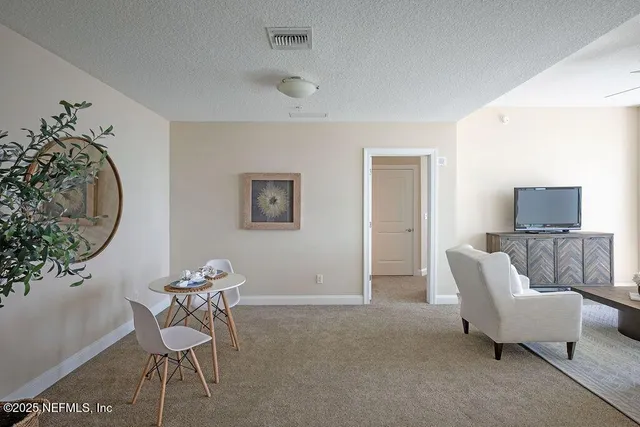 a kitchen with stainless steel appliances kitchen island granite countertop a sink and cabinets